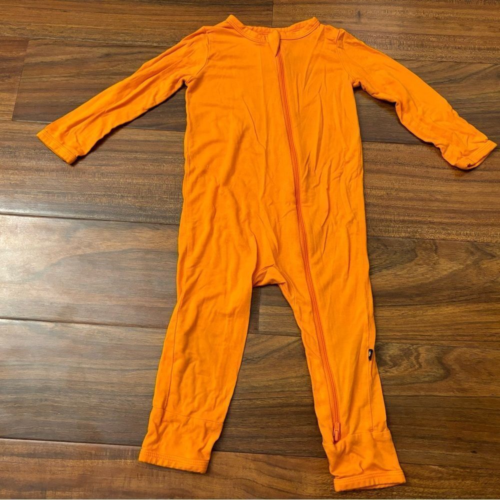 Kyte Baby Orange zip up one piece outfit.